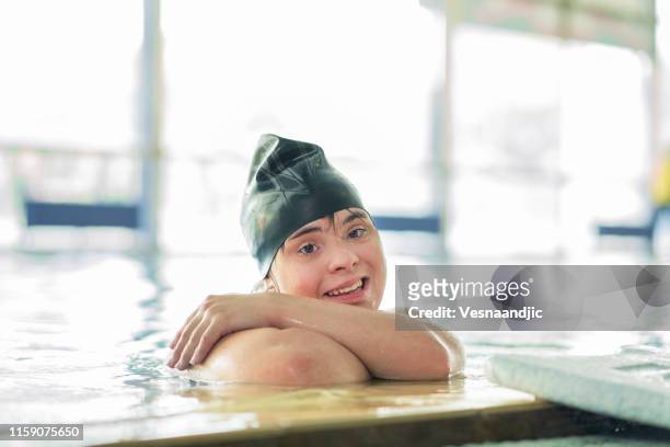 i am the happiest at swimming pool - down syndrome girl stock pictures, royalty-free photos & images
