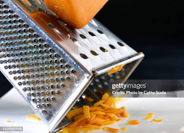 grating cheese - grattugia foto e immagini stock