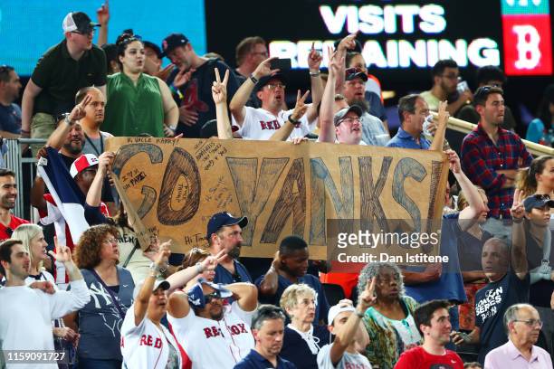 Fans show their support during the MLB London Series game between Boston Red Sox and New York Yankees at London Stadium on June 29, 2019 in London,...