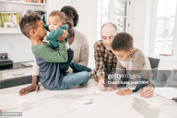 family with 3 little kids - music preservation project stock pictures, royalty-free photos & images