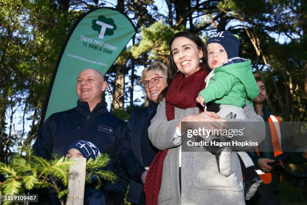 Prime Minister Jacinda Ardern looks on during a 'Trees That Count' Matariki tree planting event at Mount Victoria mountain bike skills area on June...