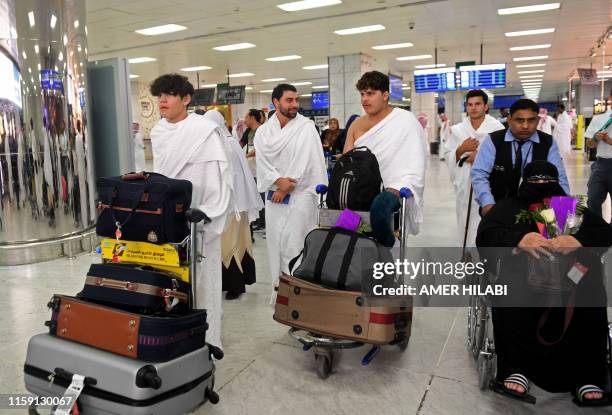 Families of victims of the March 2019 attack on mosques in New Zealand, arrive at Jeddah airport on August 2 prior to the start of the annual Hajj...