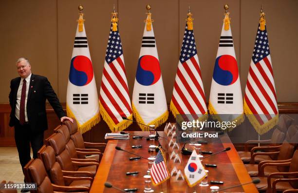 Special Envoy for North Korea Stephen Biegun waits for South Korean President Moon Jae-in and U.S. President Donald Trump before an expanded meeting...