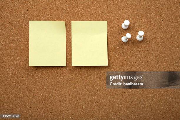 cork board with yellow sticky note - post bildbanksfoton och bilder