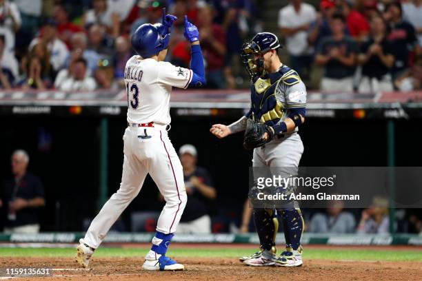 Joey Gallo of the Texas Rangers touches home plate and points to the sky after hitting a solo home run in the seventh inning during the 90th MLB...