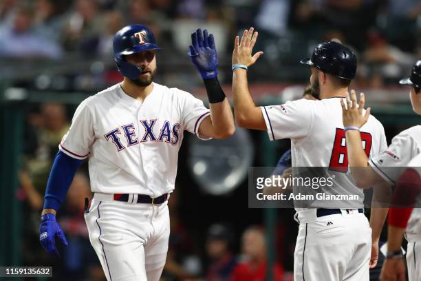 Joey Gallo of the Texas Rangers is greeted in the dugout after hitting a solo home run in the seventh inning during the 90th MLB All-Star Game at...