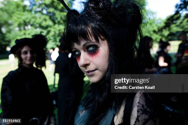 Costumed woman stays in a park during the annual Wave Gotik music festival on June 11, 2011 in Leipzig, Germany. The festival began in the 1990s and...