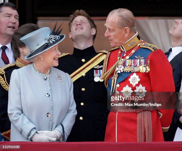 Queen Elizabeth II and Prince Philip, Duke of Edinburgh stand on the balcony of Buckingham Palace after the Trooping the Colour Parade on June 11,...