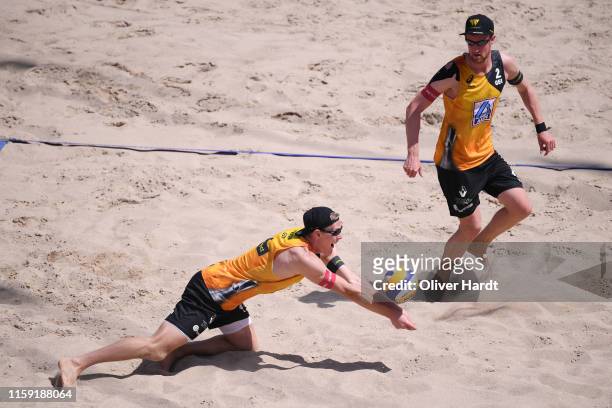 Philipp Arne Bergmann dives for the ball as Yannick Harms of Germany looks on during the match against Michal Bryl and Grzegorz Fijalek of Poland...