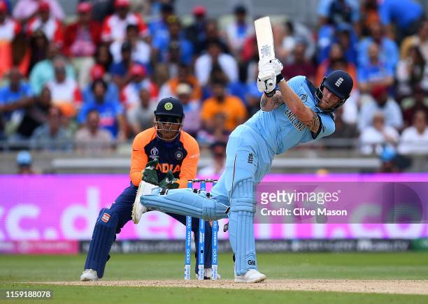 Ben Stokes of England in action batting as MS Dhoni of India looks on during the Group Stage match of the ICC Cricket World Cup 2019 between England...