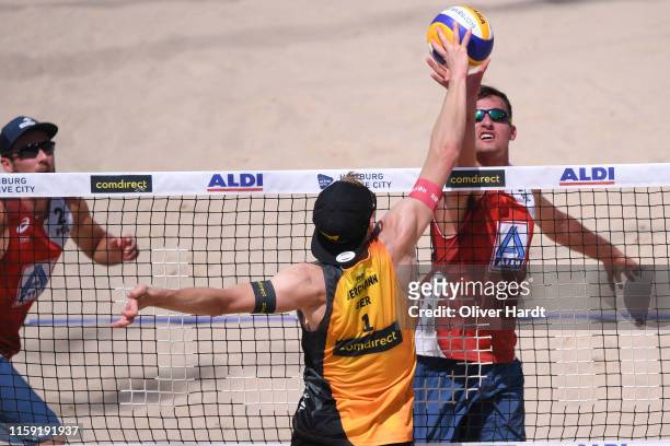 Michal Bryl of Poland blocks the ball during the match against Philipp Arne Bergmann of Germany during day three between the match Michal Bryl and...