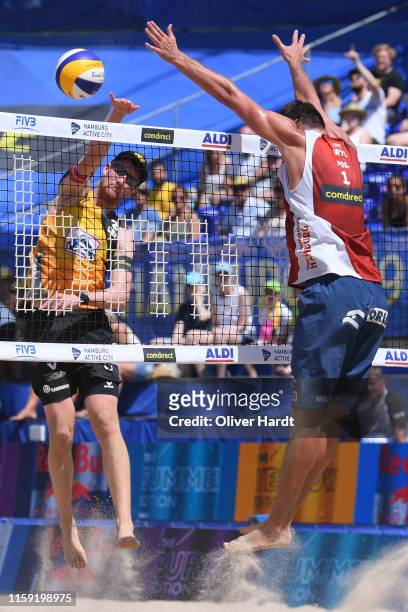 Yannick Harms of Germany spike the ball during the match againsts Michal Bryl of Poland during day three between the match Michal Bryl and Grzegorz...