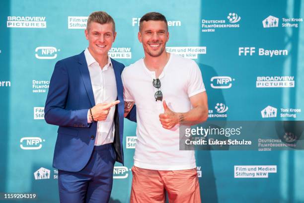 Toni Kroos and Lukas Podolski attend the world premiere of the film "Kroos" at Cinedom on June 30, 2019 in Cologne, Germany.