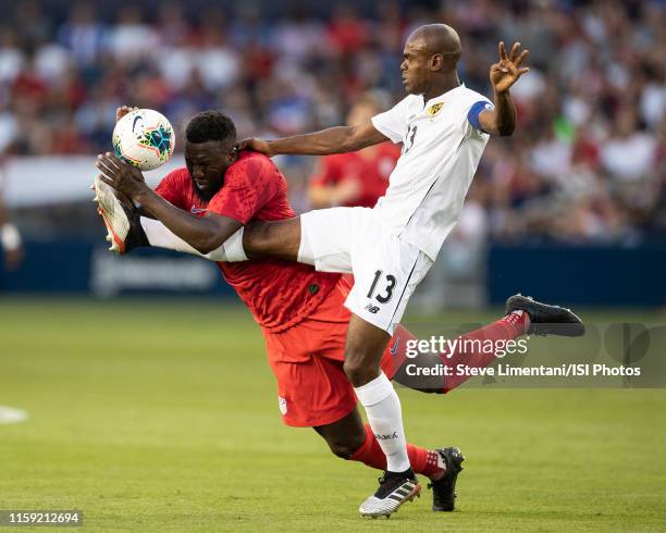Jozy Altidore of the United States and Harold Cummings of Panama go after the ball during a 2019 CONCACAF Gold Cup group D match between United...