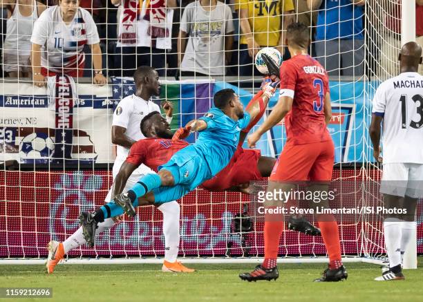 Panama goalkeeper Jose Calderon reaches for the ball as Jozy Altidore of the United States lines up a bicycle kick for the USA"u2019s goal during a...