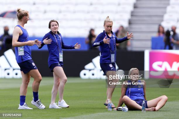 Samantha Mewis, Rose Lavelle and Emily Sonnett perform dance moves during the USA team pitch familiarization during the FIFA Women's World Cup France...