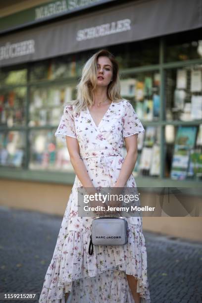 Vanessa Stanat wearing a Tigha dress, Zara heels and Marc Jacobs bag on June 30, 2019 in Berlin, Germany.