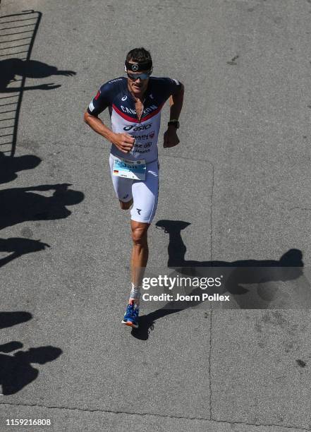 Jan Frodeno of Germany competes in the run leg during Mainova IRONMAN European Championship on June 30, 2019 in Frankfurt am Main, Germany.