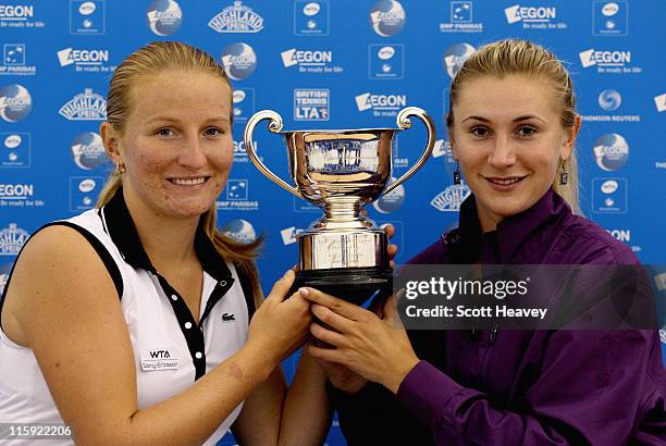 Olga Govortsova of Belarus and Alla Kudryavtseva of Russia hold the winners trophy after victory over Sara Errani and Roberta Vinci of Italy during...