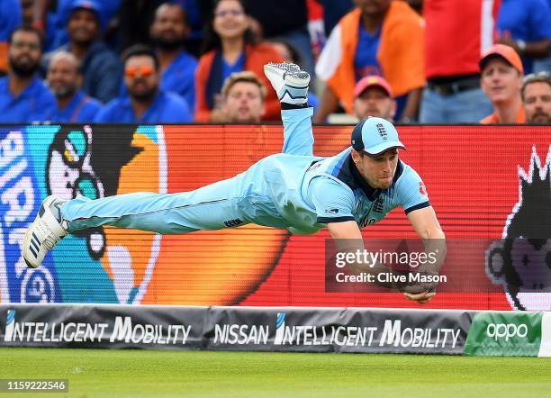 Chris Woakes dives to take a catch to dismiss Rishabh Pant of India during the Group Stage match of the ICC Cricket World Cup 2019 between England...