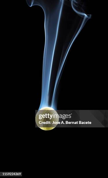 fall of a very fast tennis ball with a trail of white smoke on a black background. - tennis quick imagens e fotografias de stock