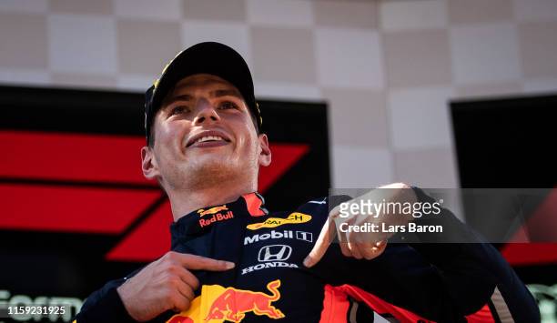 Race winner Max Verstappen of Netherlands and Red Bull Racing celebrates on the podium during the F1 Grand Prix of Austria at Red Bull Ring on June...