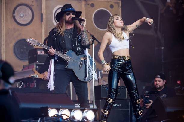 Billy Ray Cyrus and Miley Cyrus perform on the Pyramid stage on day five of Glastonbury Festival at Worthy Farm, Pilton on June 30, 2019 in...