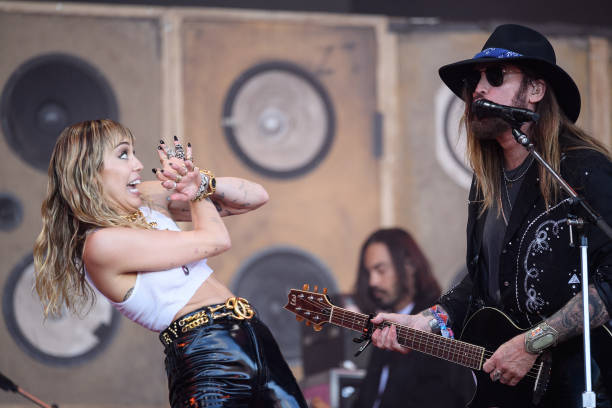 Miley Cyrus and her father Billy-Ray Cyrus perform on the Pyramid Stage on day five of Glastonbury Festival at Worthy Farm, Pilton on June 30, 2019...