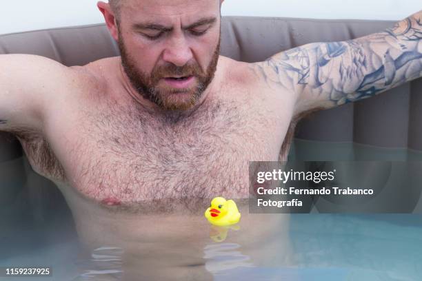 man enjoying in the pool - adult swim imagens e fotografias de stock