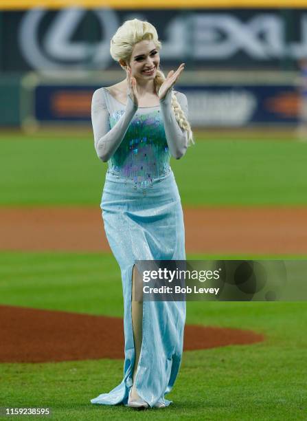 Person dressed as Disney's Princess Elsa throws out the first pitch on Princess Day at the Park at Minute Maid Park on June 30, 2019 in Houston,...
