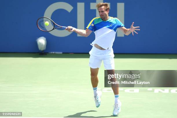 Peter Gojowczyk of Germany returns a shot from Kyle Edmunds of Great Britain during Day 5 of the Citi Open at Rock Creek Tennis Center on August 2,...