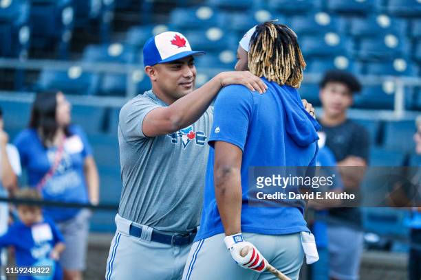 Toronto Blue Jays htting coach Guillermo Martinez with Vladimir Guerrero during batting practice before game vs Kansas City Royals at Kauffman...