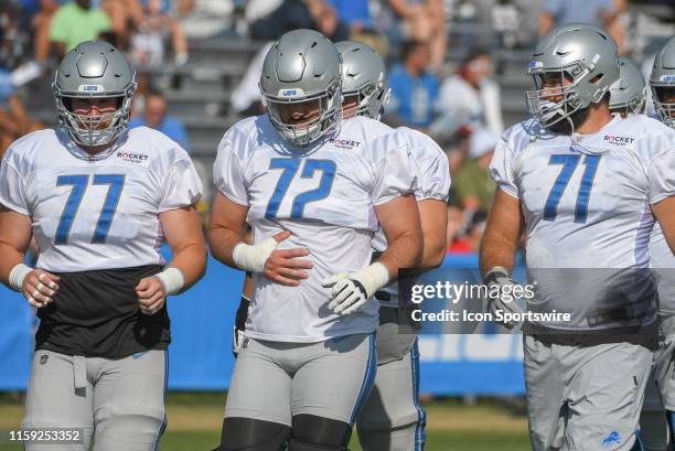 Detroit Lions OL Frank Ragnow, Detroit Lions OL Luke Bowanko, and Detroit Lions T Rick Wagner break the huddle during NFL football practice on August...