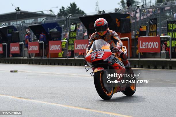 Repsol Honda Team's Spanish rider Marc Marquez arrives to a paddock for the third free practice session of the Moto GP Grand Prix of the Czech...