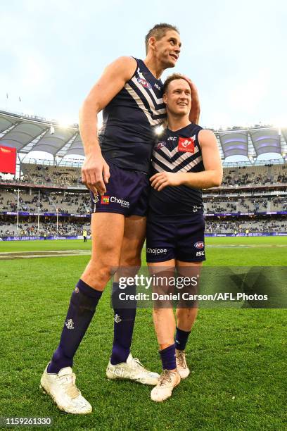 Aaron Sandilands and Brandon Matera of the Dockers celebrate the win during the 2019 AFL round 20 match between the Fremantle Dockers and the Geelong...