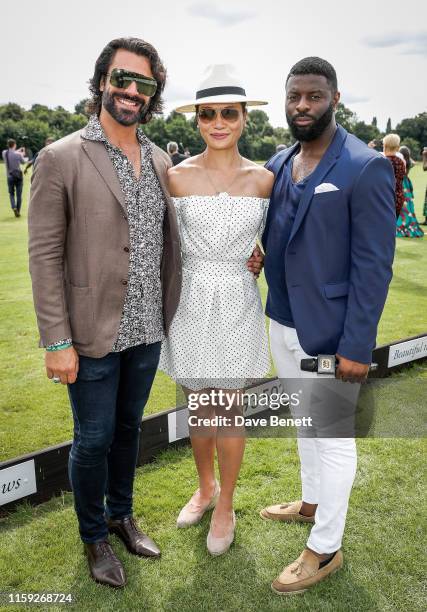 Christian Vit, Lourdes Faberes and Jay Udo-Udoma attend the Lux Afrique Polo Day at the Ham Polo Club on August 3, 2019 in Richmond, England.