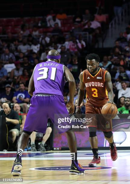 Will Bynum of the Bivouac drives against Ricky Davis the Ghost Ballers during week two of the BIG3 three on three basketball league at at the...