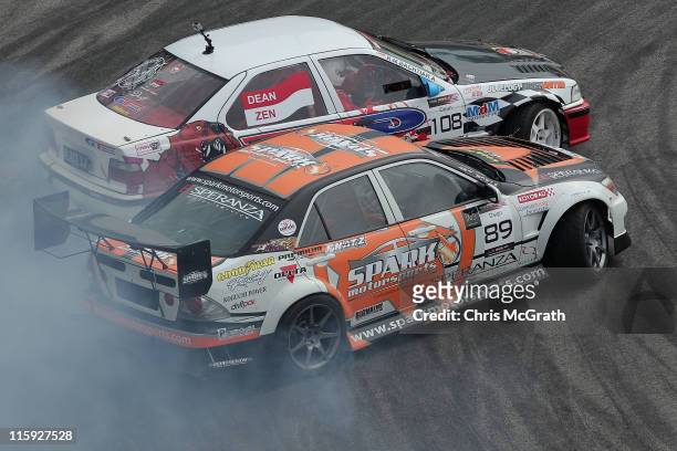 Daigo Saito of Japan driver of the Spark Motorsports Lexus Altezza chases Raden Muhammad Bachtiar Akbar of Indonesia driving the GT Radial BMW E36...