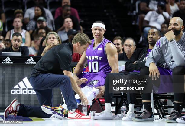 Mike Bibby of the Ghost Ballers has his leg tended to as they take on the Bivouac during week two of the BIG3 three on three basketball league at at...