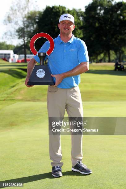 Nate Lashley celebrates with the trophy after winning the Rocket Mortgage Classic at the Detroit Country Club on June 30, 2019 in Detroit, Michigan.