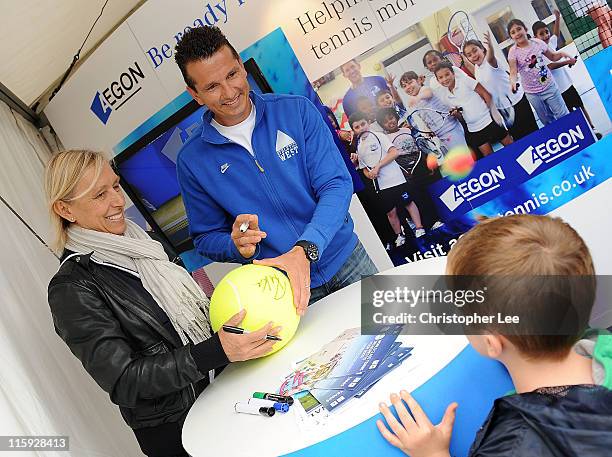 Martina Navratilova and Richard Krajicek, who were due to play a legends match, sign autographs for fans during 2nd Round Qualifying for the AEGON...