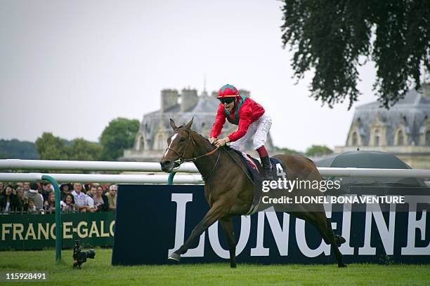 French jockey Martin Guyon rides Golden Lilac at the finish line to win the 162nd Prix de Diane horse racing, on June 12, 2011 in Chantilly, north of...