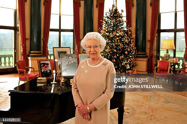 Photo dated on December 22, 2008 shows Britain's Queen Elizabeth II in the Music Room of Buckingham Palace in London after recording her Christmas...