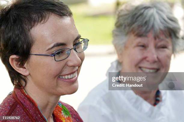 In this handout image provided by Giffords Campaign - P.K. Weis, U.S. Rep. Gabrielle Giffords sits with her mother Gloria Giffords the day after the...