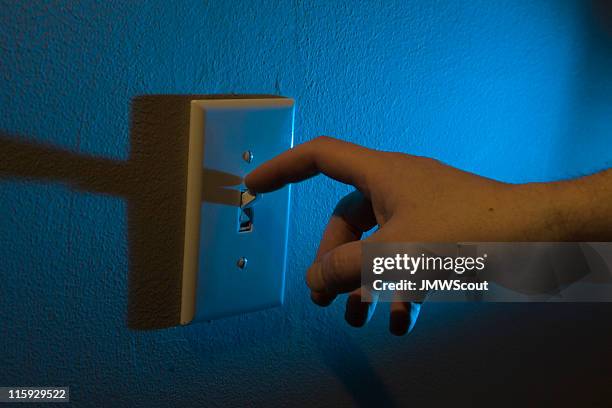 turning off the lights with finger - turning on or off stock pictures, royalty-free photos & images