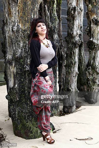 Tunisia's writer and blogger Lina Ben Mhenni poses on June 12, 2011 in Saint-Malo, Brittany, western France, during the 22nd edition of the...