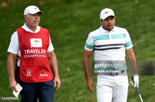 Jason Day talks with caddie Steve Williams on the 15th hole during the third round of the Travelers Championship at TPC River Highlands on June 22,...