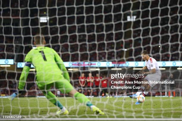 Andre Silva of Milan takes a penalty during the 2019 International Champions Cup match between Manchester United and AC Milan at Principality Stadium...
