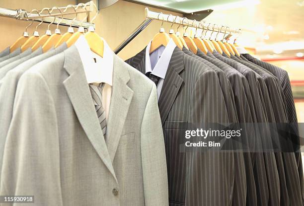 suits for sale - suit rack stock pictures, royalty-free photos & images