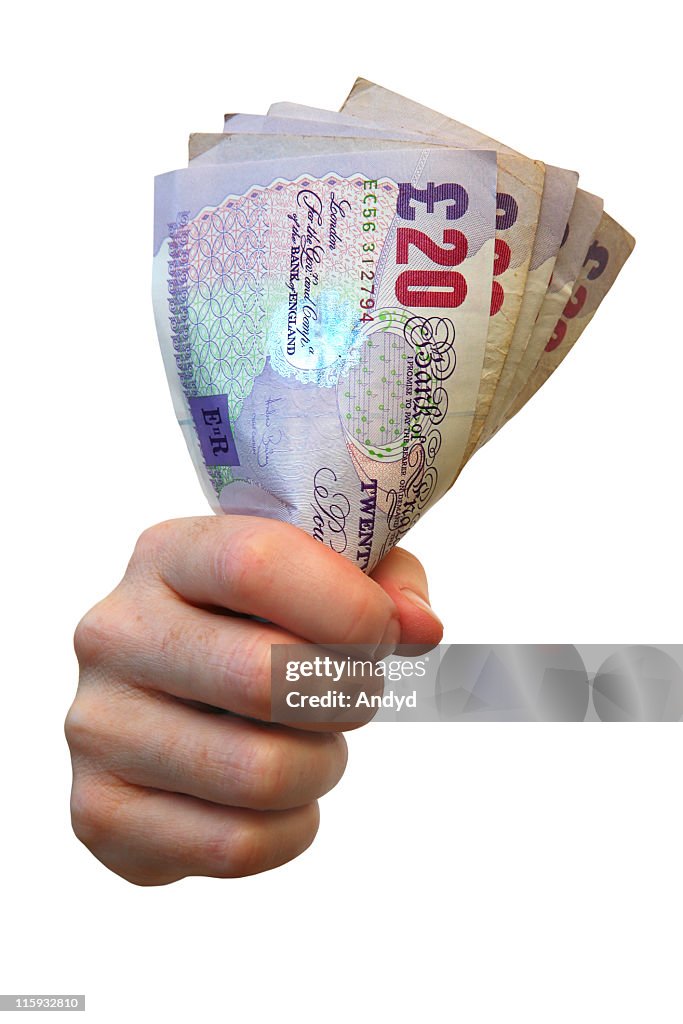 Clenched fist full of money isolated on white background